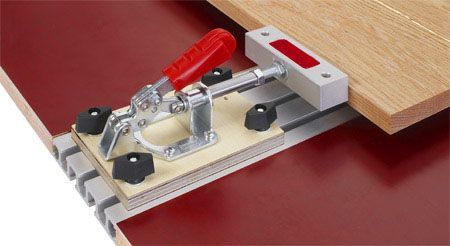 Precise woodworking edge clamp used for delicate carpentry projects, ensuring strong glue joints and accurate assembly in professional workshop settings.