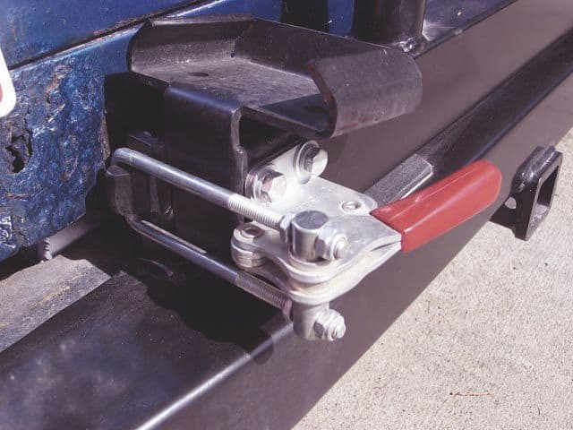 Threaded bolt tensioner pallet stabilizer bar clamp, industrial machinery equipment for securing metal components.