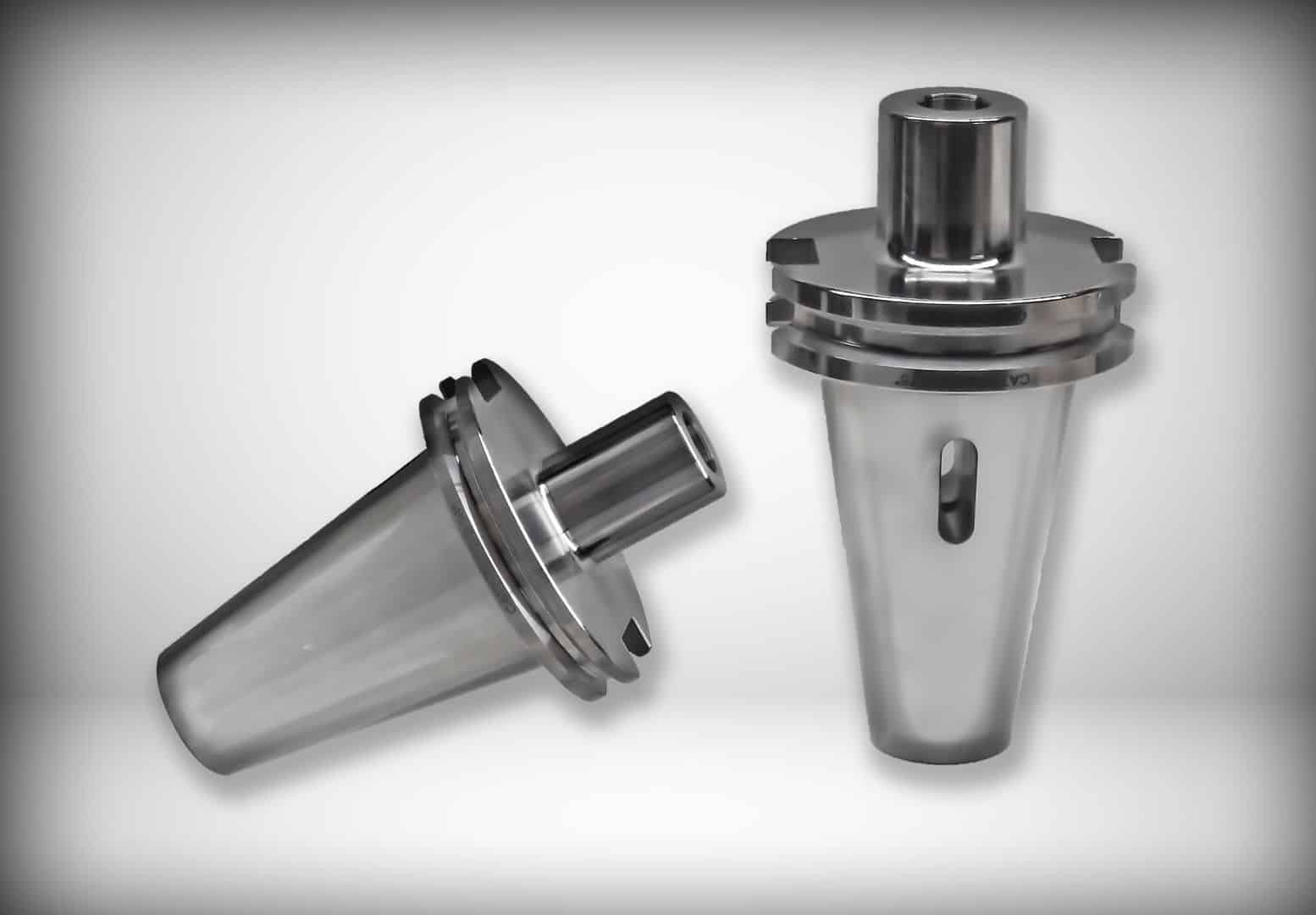 Precision metal machine components on a white background, showcasing industrial parts for manufacturing and engineering applications.