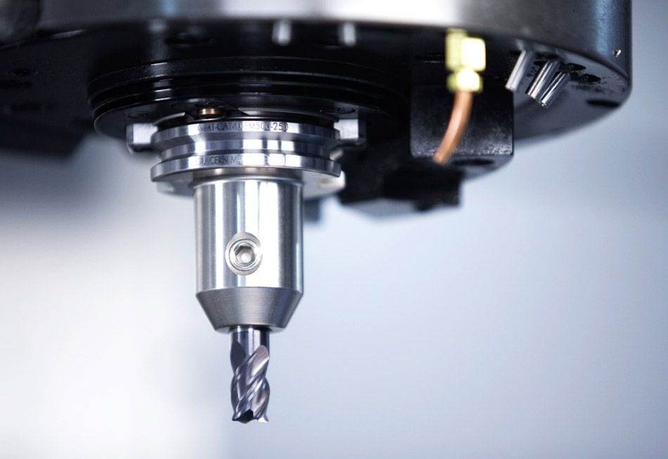 Precision CNC machine tool with high-speed drill bit for manufacturing and industrial machining processes.