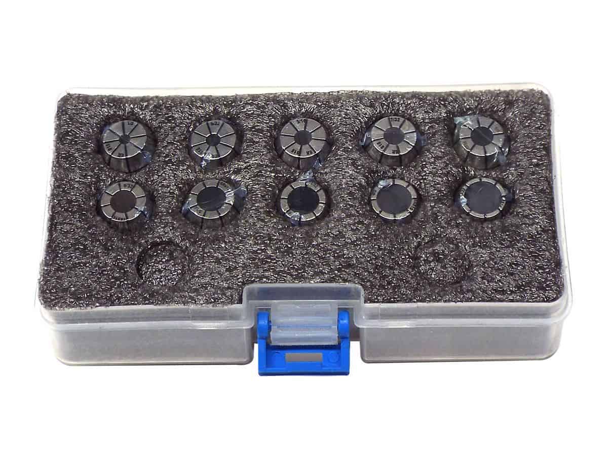 Precision metal gauge dial indicators in a clear plastic storage case.