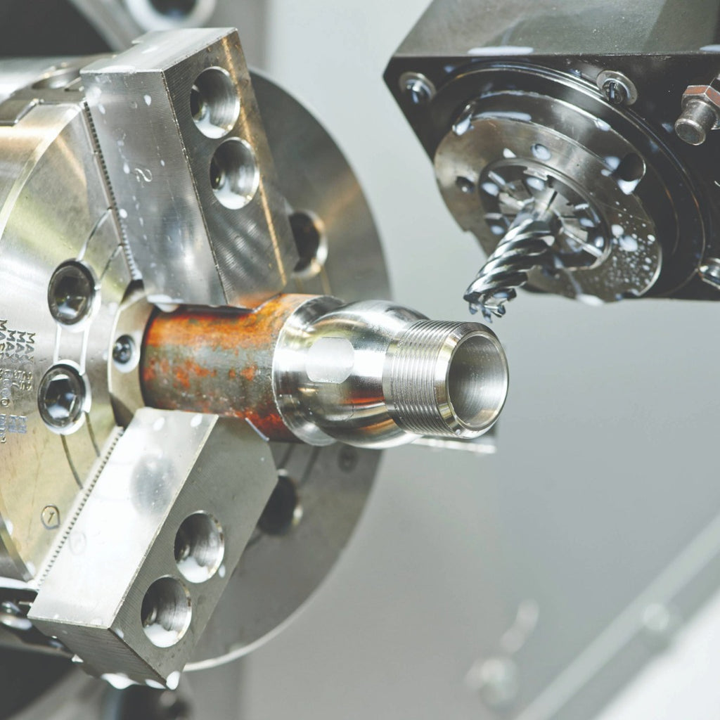 Precision CNC machine tool holders and collets displayed on a workbench, emphasizing high-quality industrial manufacturing equipment.